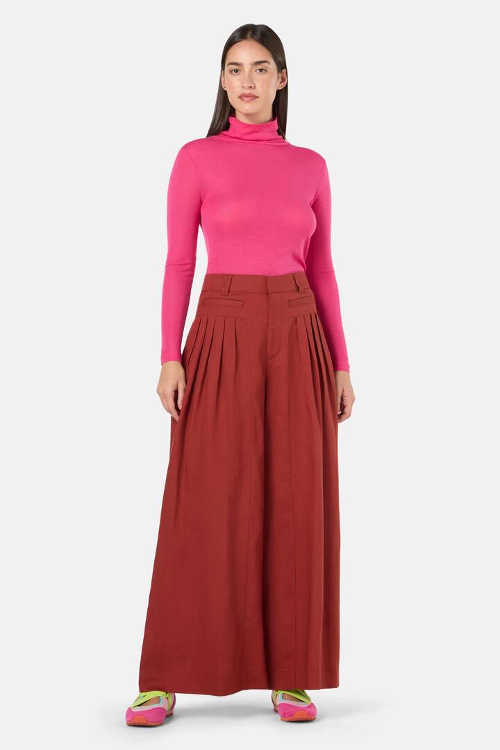 Image of a model wearing Pants. Product name - Carnaby Pant in Rust colour by brand - Gorman