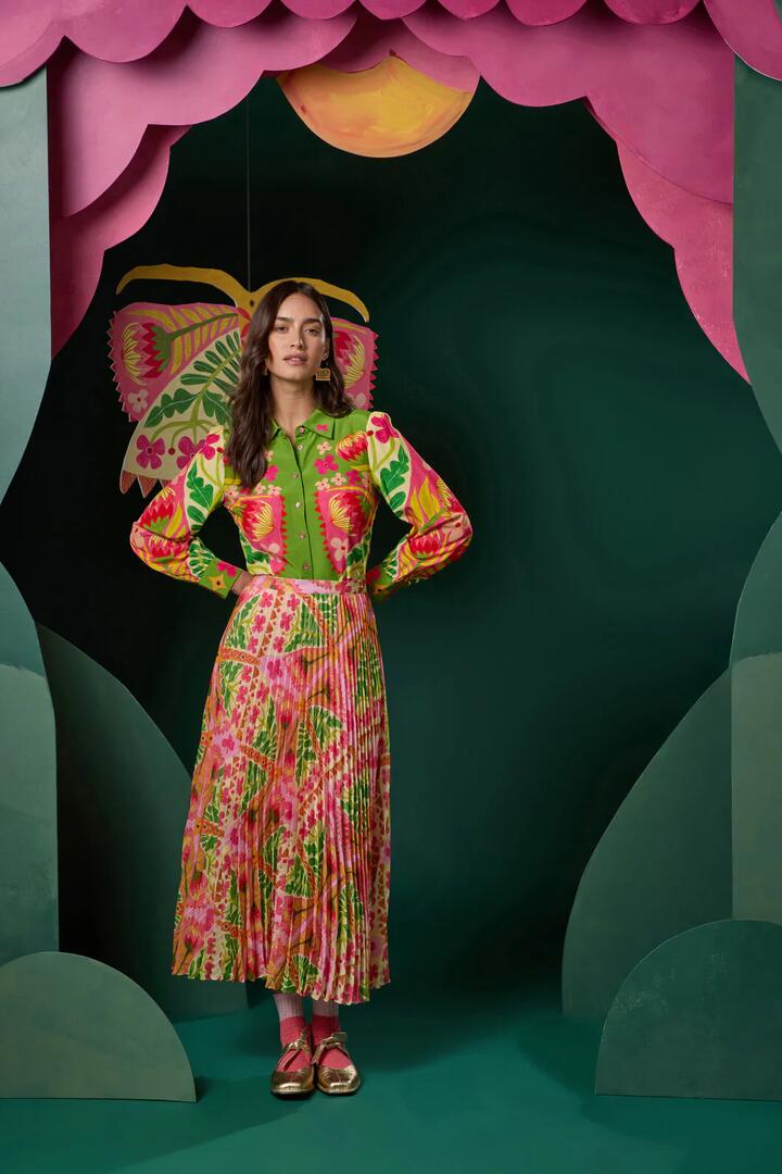 Image of a model wearing Skirts. Product name - Metamorphosis Pleat Skirt in Print colour by brand - Gorman