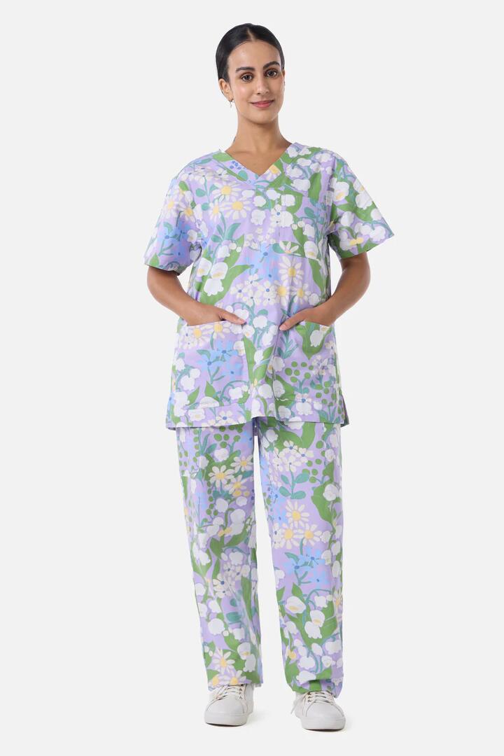 Image of a model wearing Uniforms & Workwear. Productname: Lily Of The Valley Scrub Set in Lilac colour by brand - Scrubs With Love