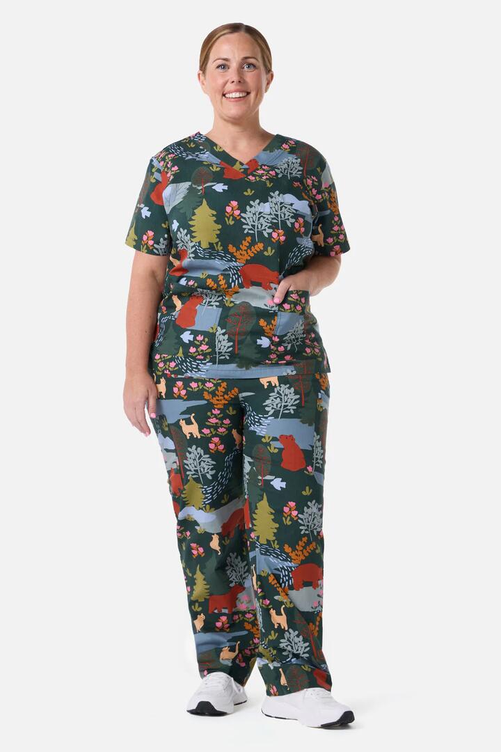 Image of a model wearing Uniforms & Workwear. Productname: Woodland Bear Scrub Set in Green colour by brand - Scrubs With Love