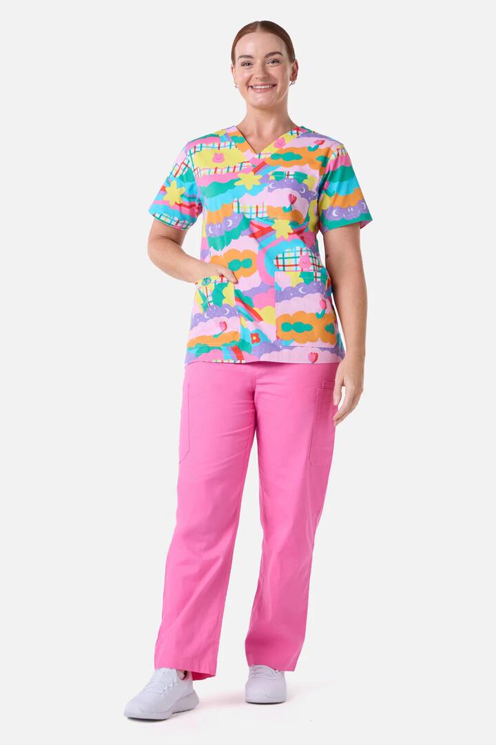 Image of a model wearing Uniforms & Workwear. Productname: Idolize Top & Pant Scrub Set in Pink colour by brand - Scrubs With Love