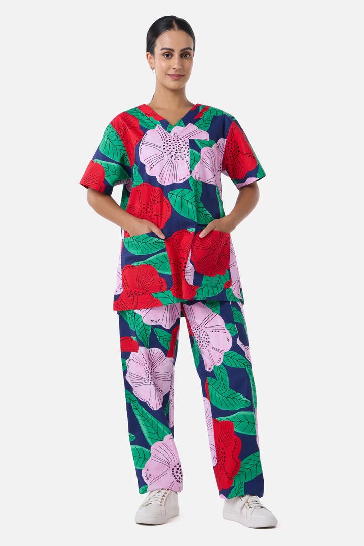 Image of a model wearing Uniforms & Workwear. Product name - Camellia Floral Scrub Set in Navy colour by brand - Gorman