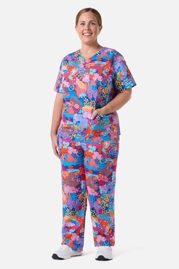 Image of a model wearing Uniforms & Workwear. Product name - Kimono Collage Scrub Set in Multi colour by brand - Gorman