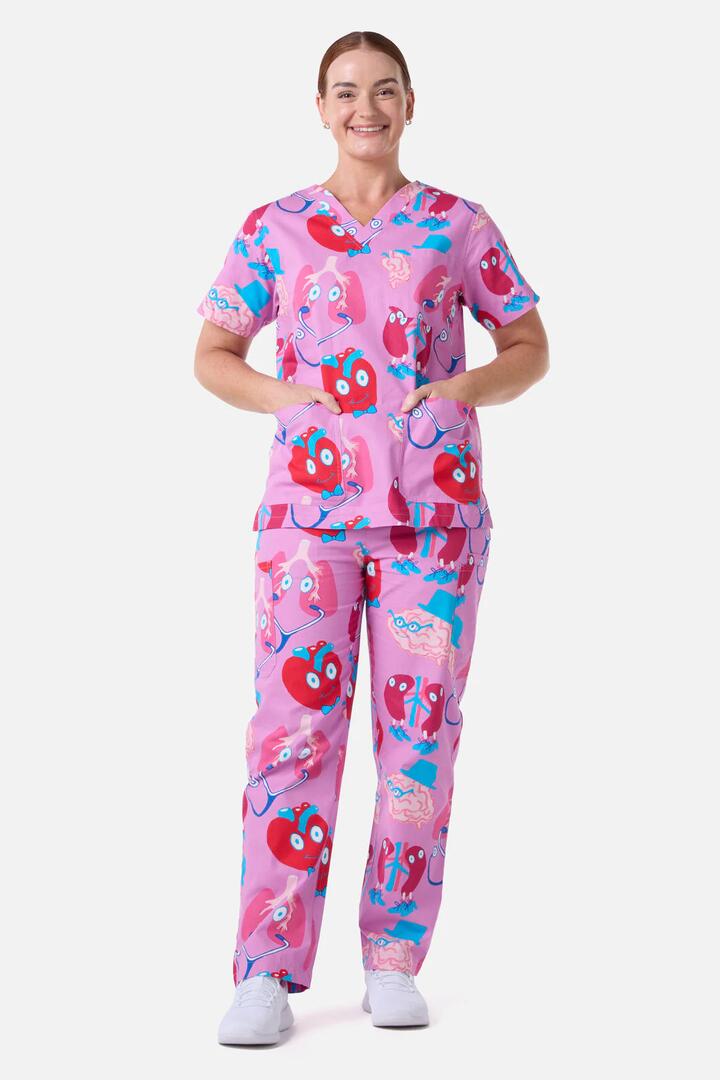 Image of a model wearing Uniforms & Workwear. Product name - Happy Organs Scrub Set in Pink colour by brand - Gorman