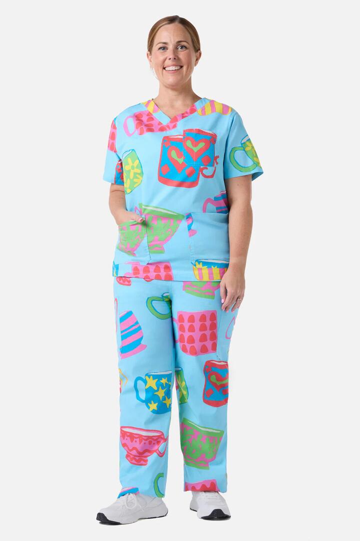 Image of a model wearing Uniforms & Workwear. Product name - Tea Break Scrub Set in Blue colour by brand - Gorman
