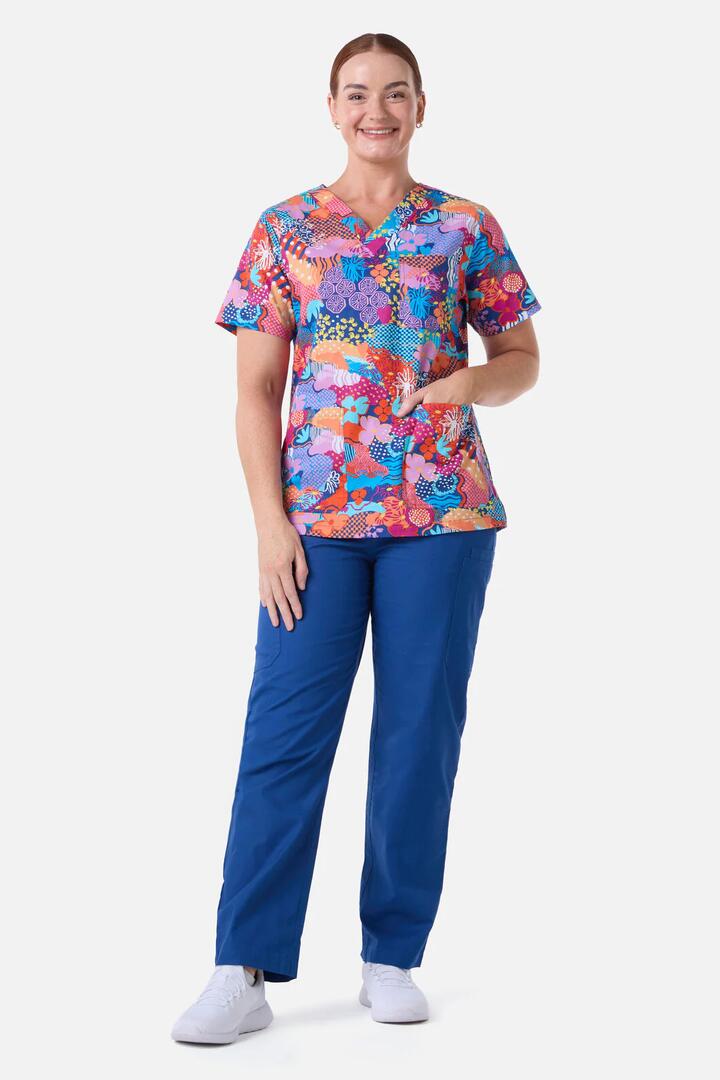 Image of a model wearing Uniforms & Workwear. Product name - Collage Scrub Top & Pant Set in Navy colour by brand - Gorman