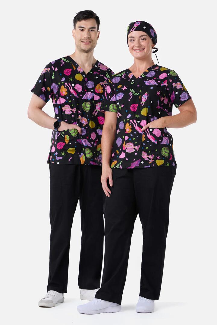 Image of a model wearing Uniforms & Workwear. Product name - Deep Dive Top & Pant Scrub Set in Black colour by brand - Gorman