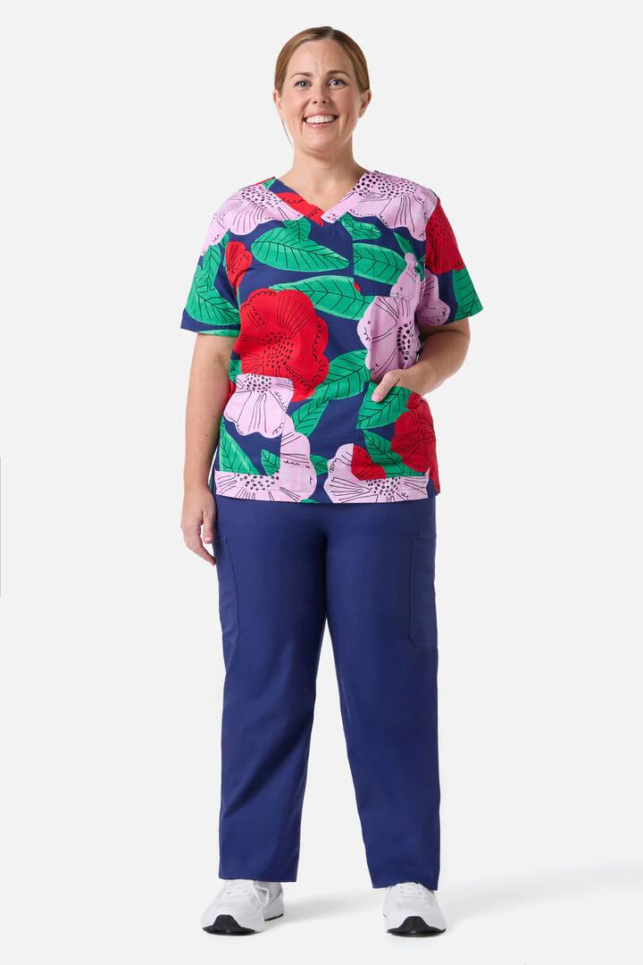 Image of a model wearing Uniforms & Workwear. Product name - Camellia Top & Pant Scrub Set in Navy colour by brand - Gorman