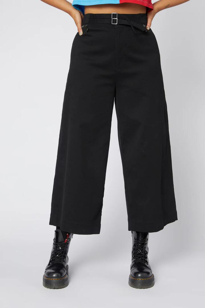 Image of a model wearing Pants. Productname: Ace Wide Leg Drill Pant in Black colour by brand - Dangerfield