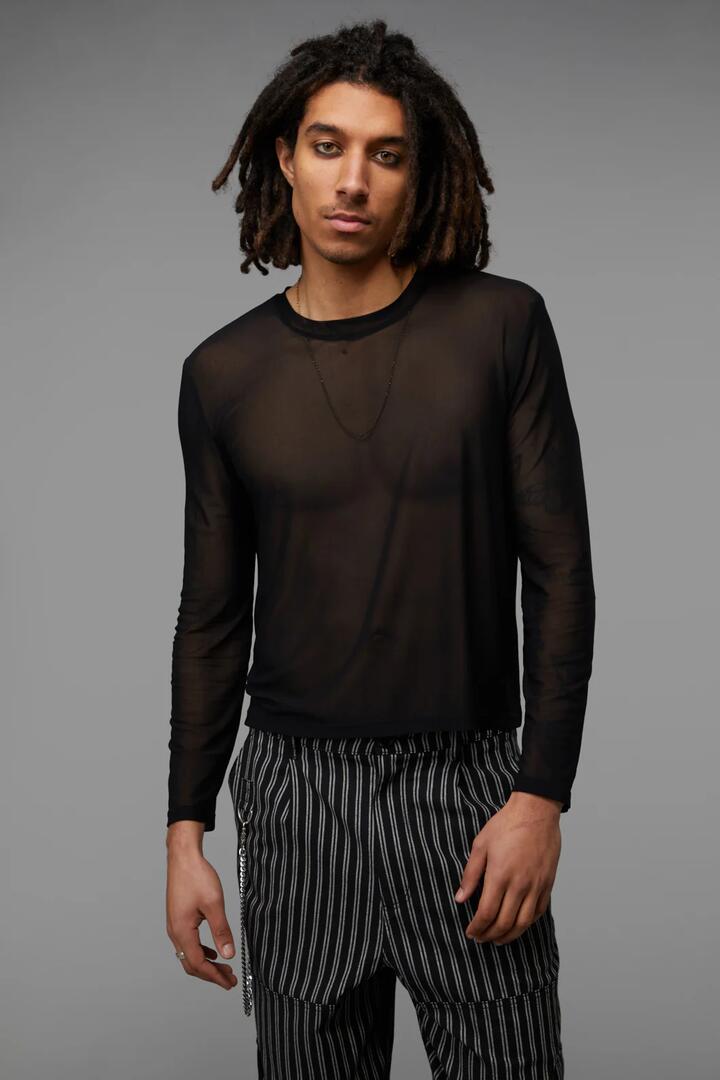 Image of a model wearing Tops. Productname: Back Alley Long Sleeve Mesh Top in Black colour by brand - Black Friday