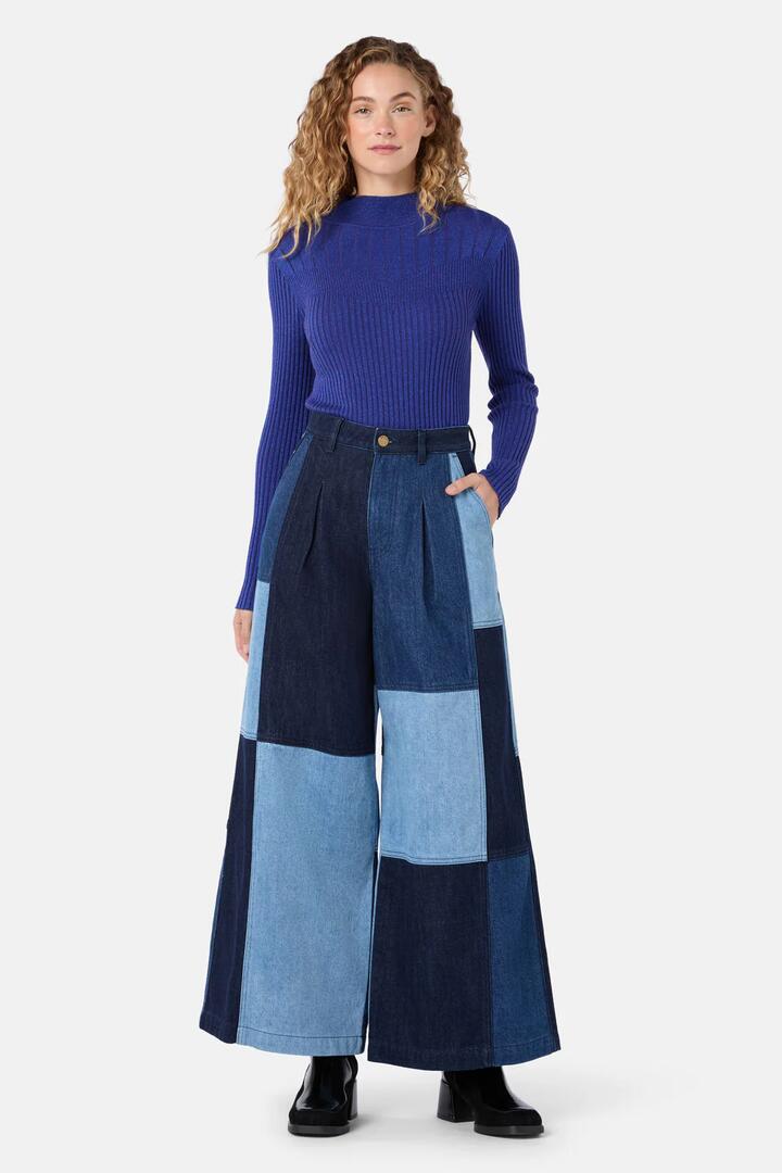 Image of a model wearing Skirts. Product name - Puzzle Denim Spliced Skort in Denim colour by brand - Gorman