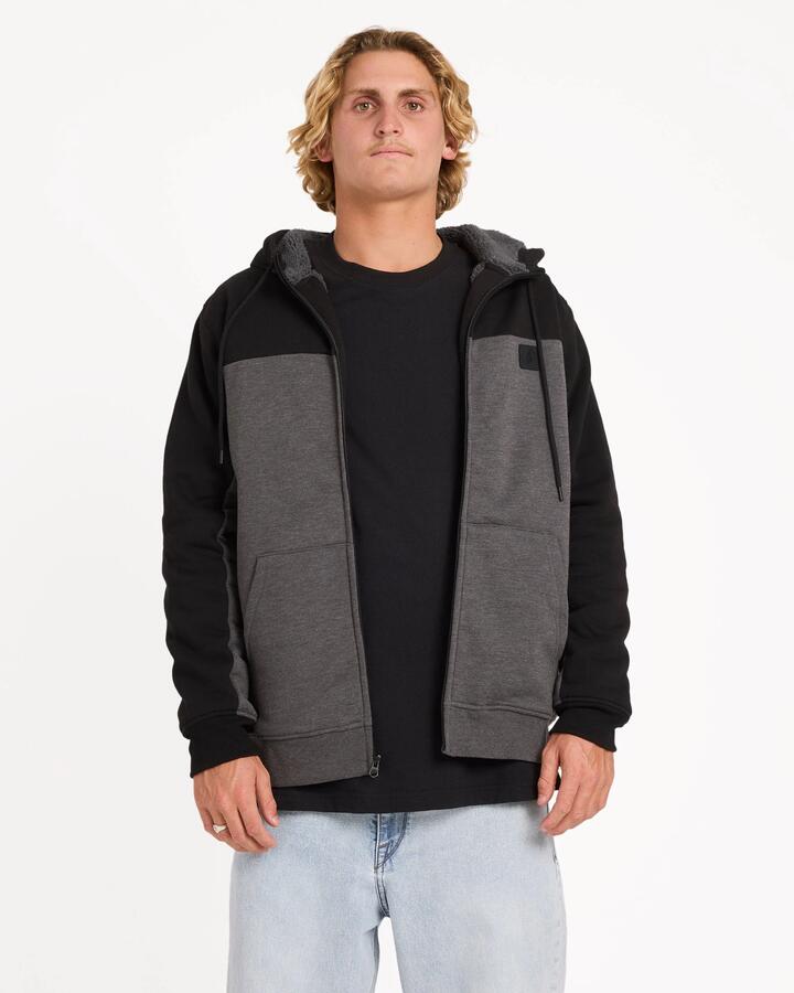 Image of a model wearing Outerwear. Product name - Volcom Mens Division Lined Zip Up Hoodie Charcoal Heather in Charcoal Heather colour by brand - Volcom
