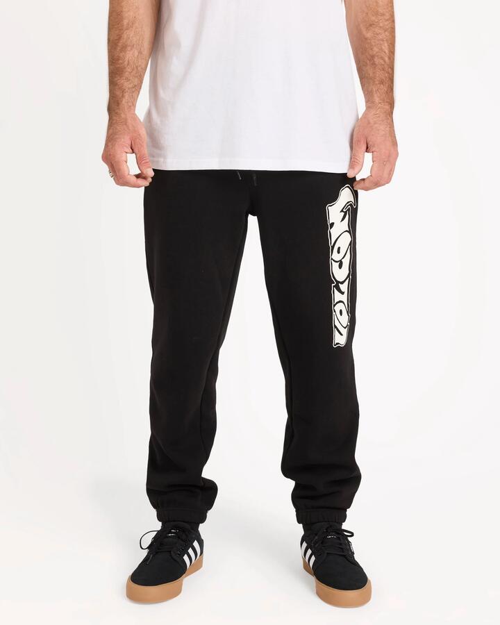 Image of a model wearing Pants. Product name - Volcom Mens Embstone Trackpants Black in Black colour by brand - Volcom