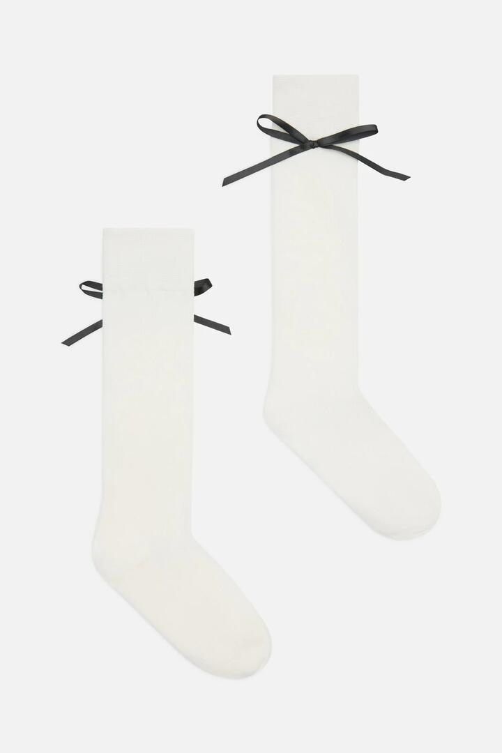 Image of Socks. Productname: White Knee High Bow Socks in White colour by brand - Princess Highway