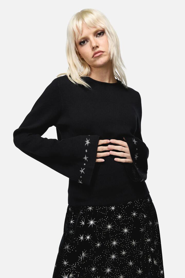 Image of a model wearing Tops. Productname: Feathers Goth Knit in Black colour by brand - Dangerfield
