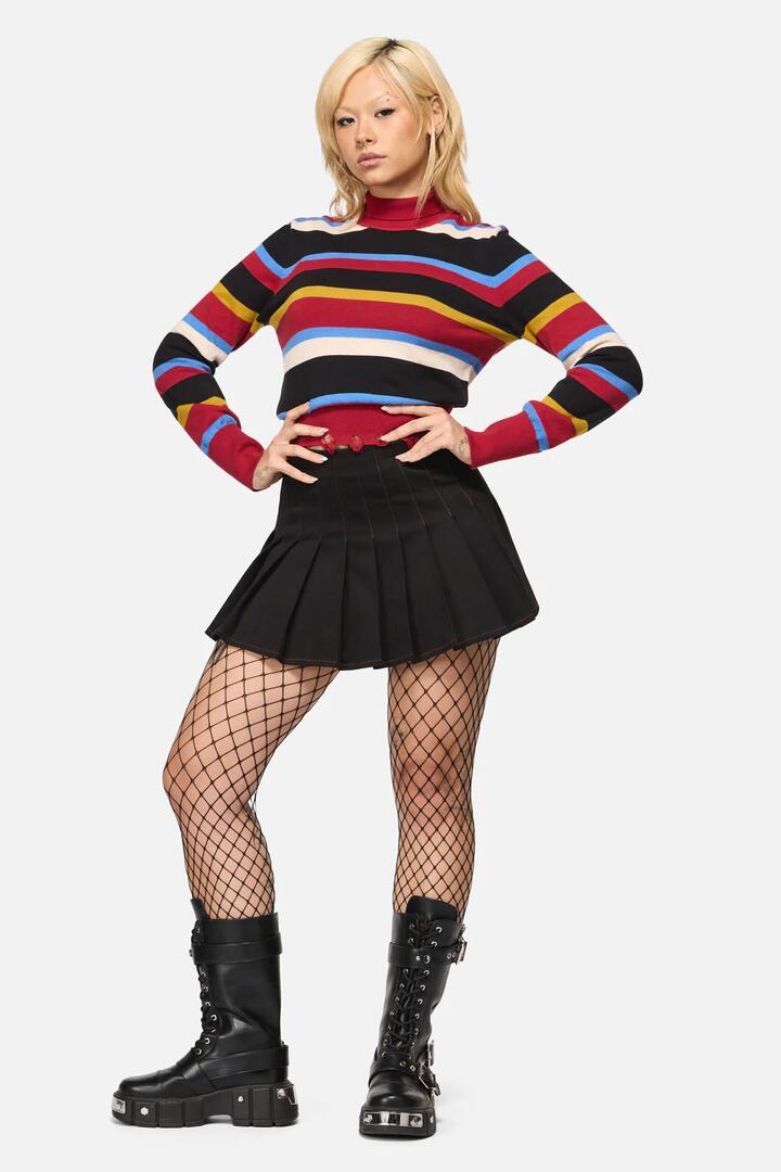 Image of a model wearing Skirts. Productname: Riot Goth Pleated Skort in Black colour by brand - Black Friday