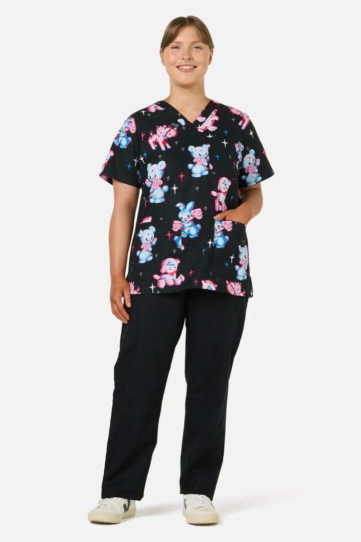 Image of a model wearing Uniforms & Workwear. Productname: Poppet Top & Pant Scrub Set in Black colour by brand - Scrubs With Love