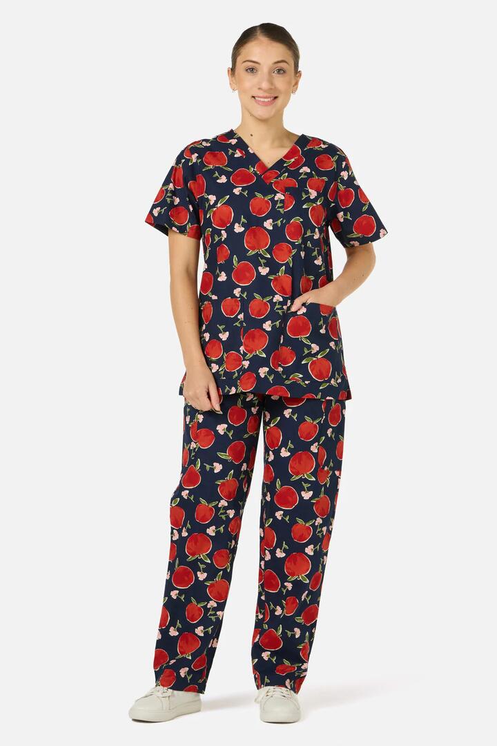 Image of a model wearing Uniforms & Workwear. Productname: Sweet Apple Scrub Set in Navy colour by brand - Scrubs With Love