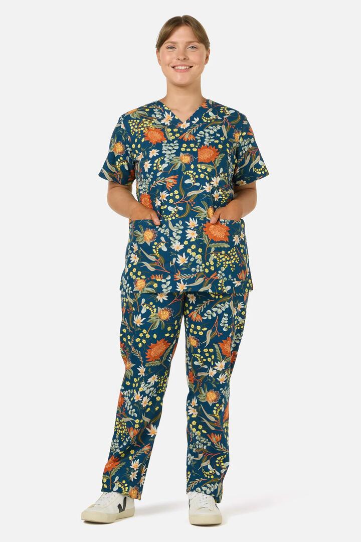 Image of a model wearing Uniforms & Workwear. Productname: Opal Native Scrub Set in Teal colour by brand - Scrubs With Love