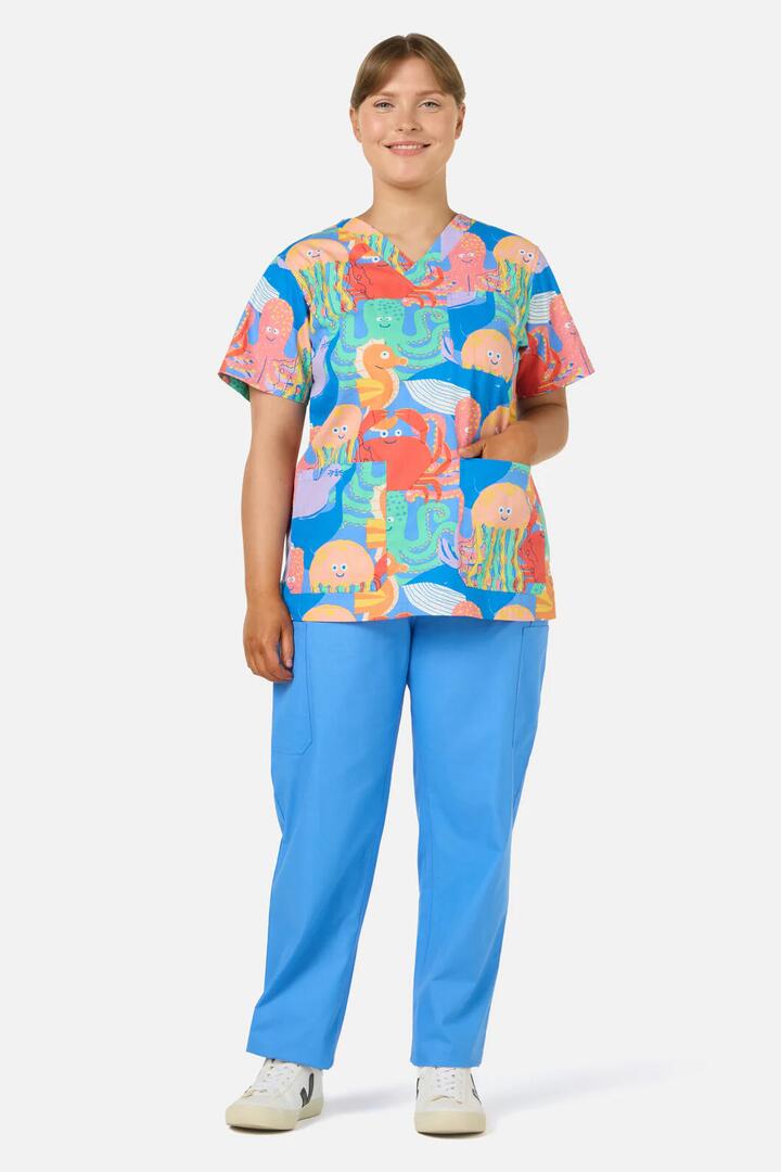 Image of a model wearing Uniforms & Workwear. Product name - Sea Creatures Top & Pant Scrub Set in Blue colour by brand - Gorman