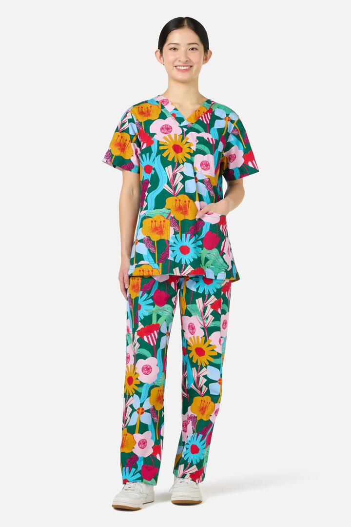 Image of a model wearing Uniforms & Workwear. Product name - Paper Blooms Scrub Set in Green colour by brand - Gorman