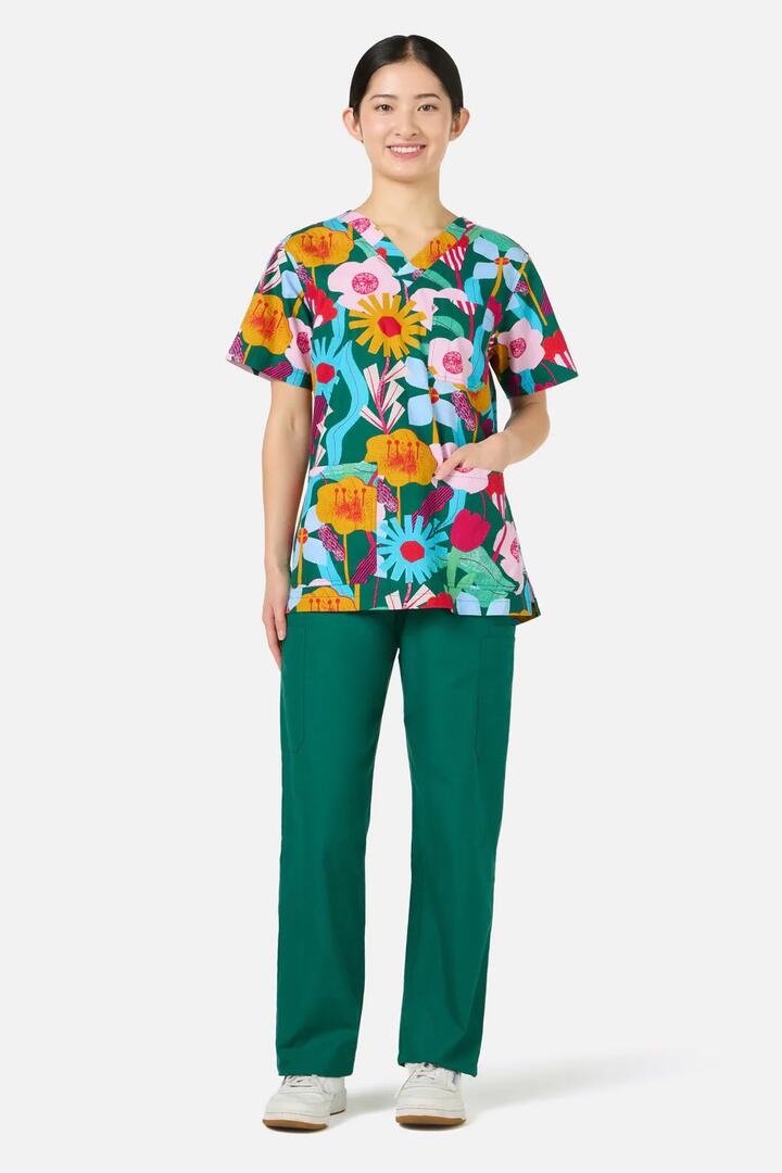 Image of a model wearing Uniforms & Workwear. Product name - Paper Blooms Top & Pant Scrub Set in Green colour by brand - Gorman