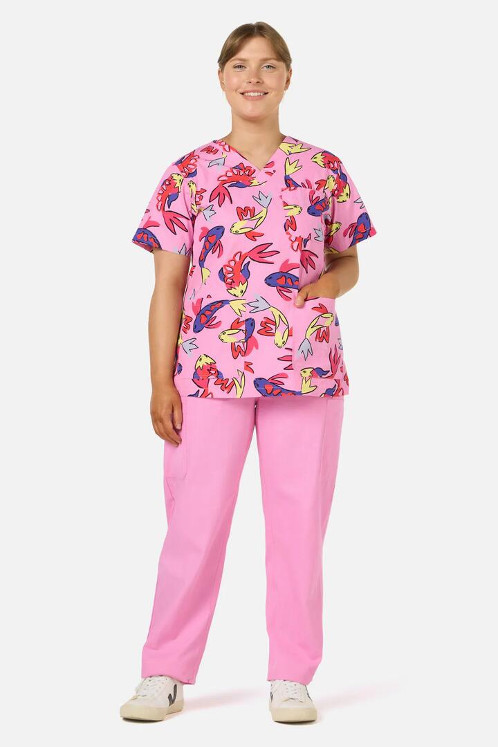Image of a model wearing Uniforms & Workwear. Product name - Koi Pond Top & Pant Scrub Set in Pink colour by brand - Gorman