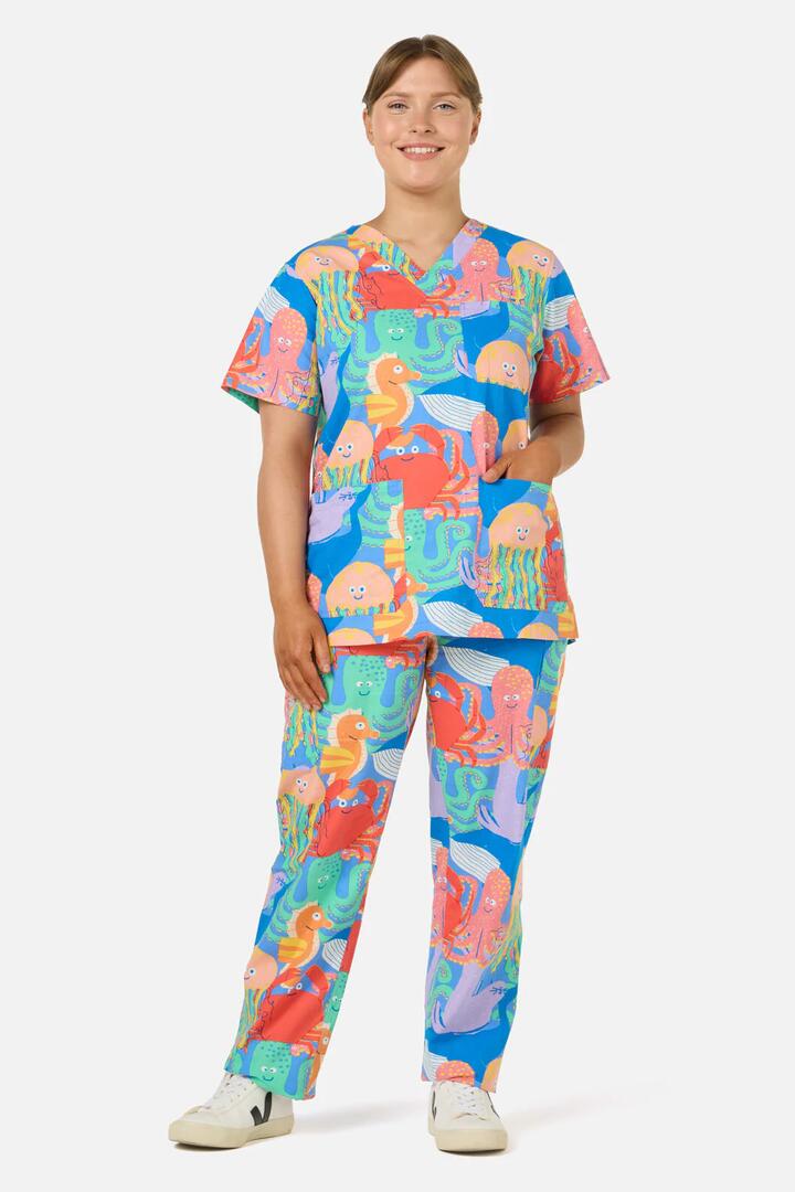 Image of a model wearing Uniforms & Workwear. Product name - Sea Creatures Scrub Set in Blue colour by brand - Gorman