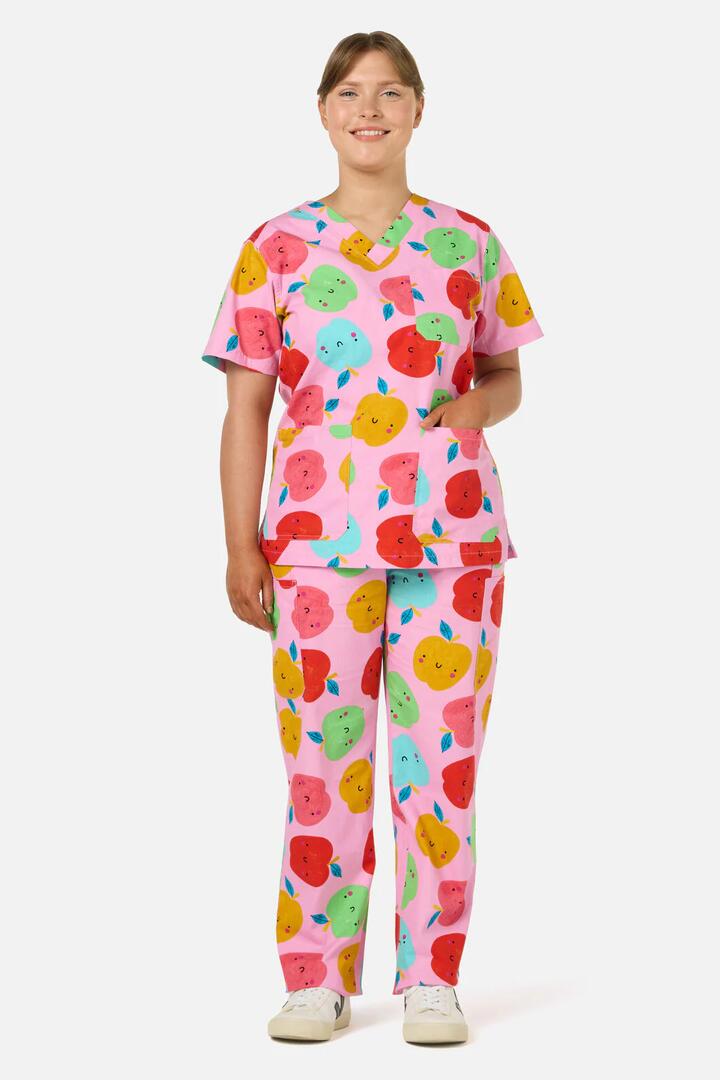Image of a model wearing Uniforms & Workwear. Product name - She's Apples Scrub Set in Pink colour by brand - Gorman
