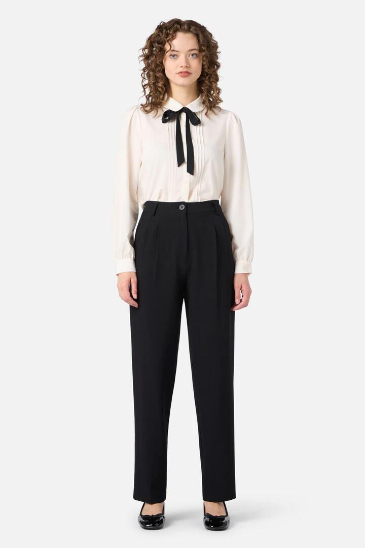 Image of a model wearing Pants. Productname: Rita Pant in Black colour by brand - Princess Highway