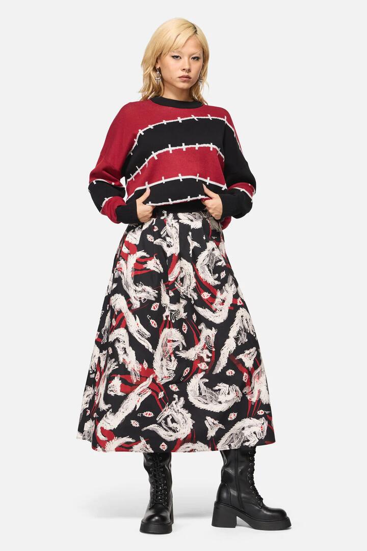 Image of a model wearing Skirts. Productname: Louve Print Pleated Midi Skirt in Black colour by brand - Black Friday