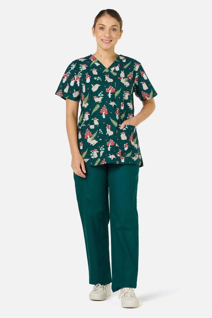 Image of a model wearing Uniforms & Workwear. Productname: Harmony Top & Pant Scrub Set in Green colour by brand - Scrubs With Love