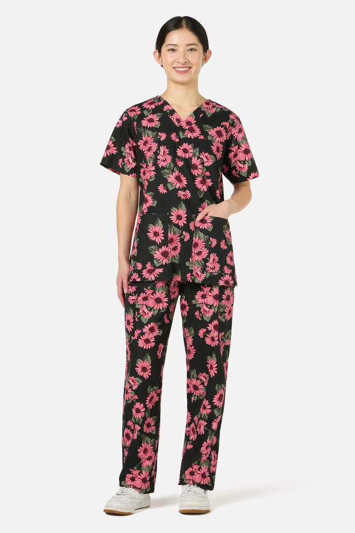 Image of a model wearing Uniforms & Workwear. Productname: Winter Daisy scrub set in Green colour by brand - Scrubs With Love