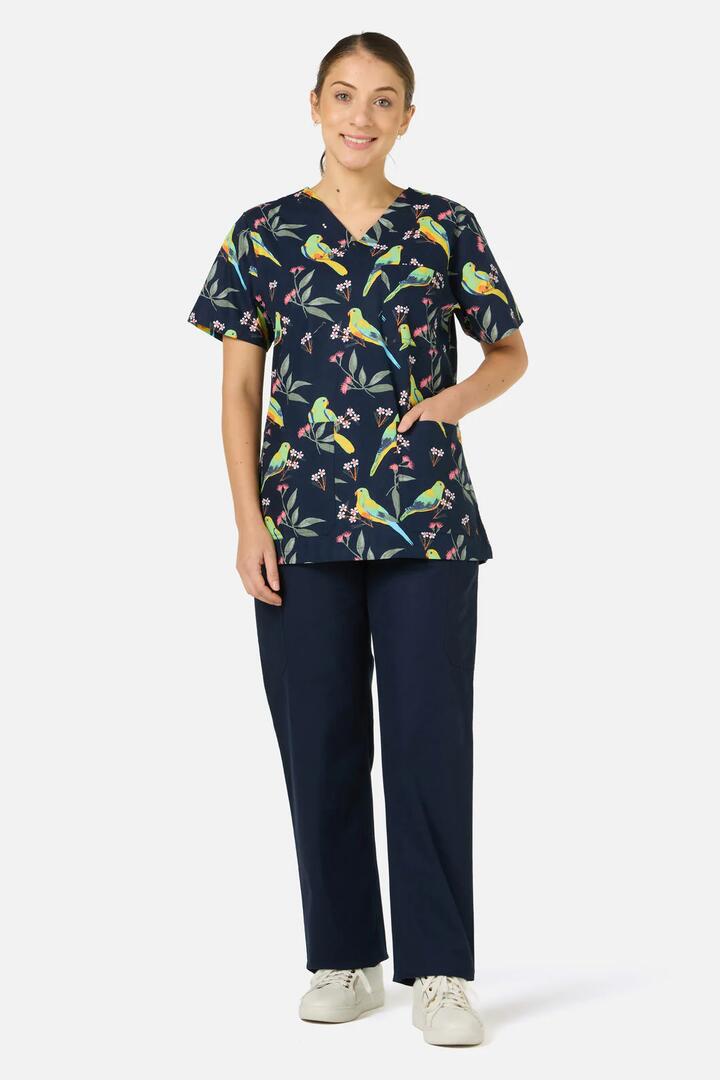 Image of a model wearing Uniforms & Workwear. Productname: Parrot Top & Pant Scrub Set in Navy colour by brand - Scrubs With Love