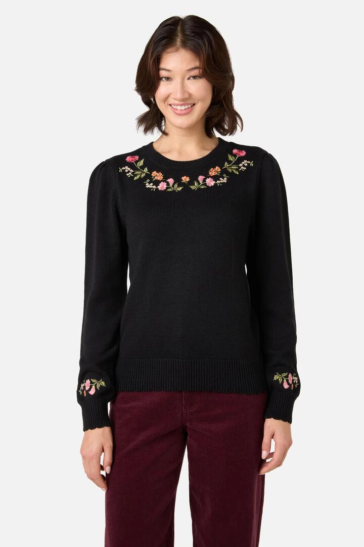 Image of a model wearing Outerwear. Productname: Winona Flower Embroidered Jumper in Black colour by brand - Princess Highway