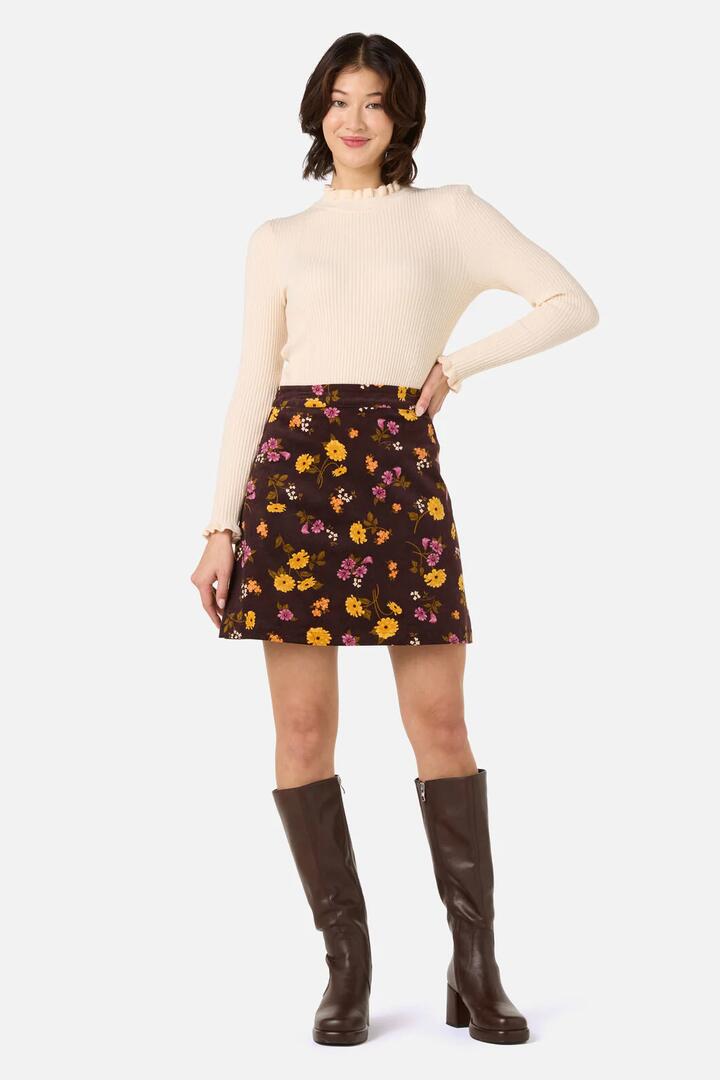 Image of a model wearing Skirts. Productname: Winona Flower Corduroy Skirt in Chocolate colour by brand - Princess Highway
