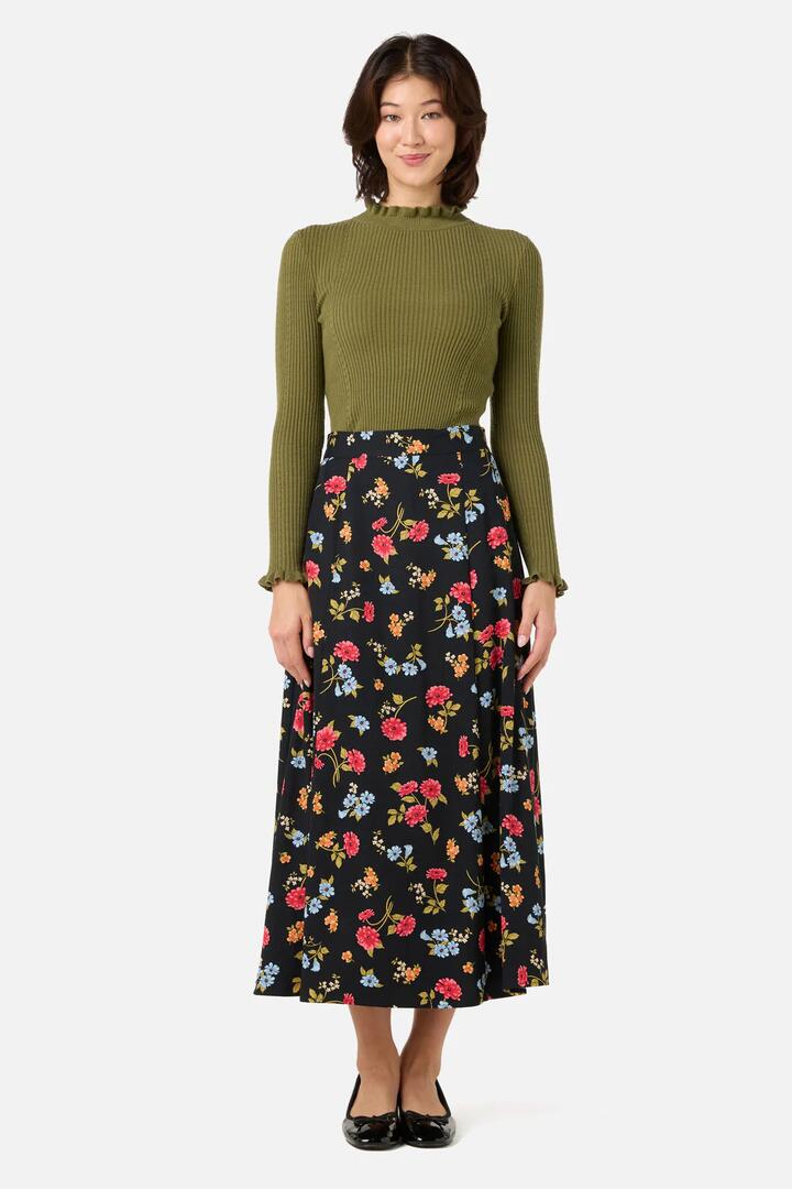 Image of a model wearing Skirts. Productname: Winona Flower Midi Skirt in Black colour by brand - Princess Highway