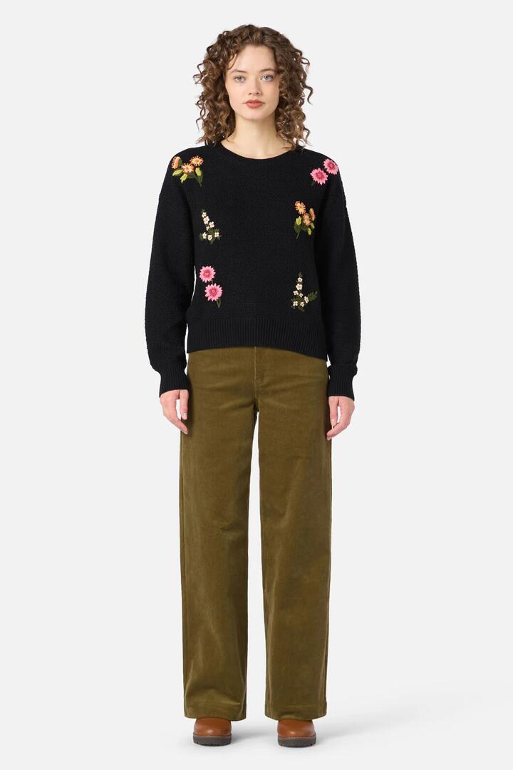 Image of a model wearing Outerwear. Productname: Native Embroidered Jumper in Black colour by brand - Princess Highway