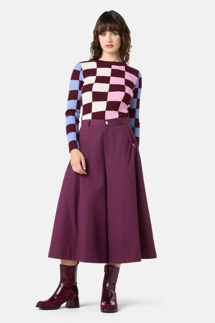 Image of a model wearing Skirts. Product name - Monica Toggle Skort in Deep Purple colour by brand - Gorman