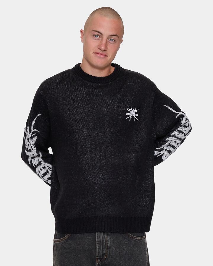 Image of a model wearing Tops. Product name - Worship Mens Trudge Knit Crew Neck Black in Black colour by brand - Worship