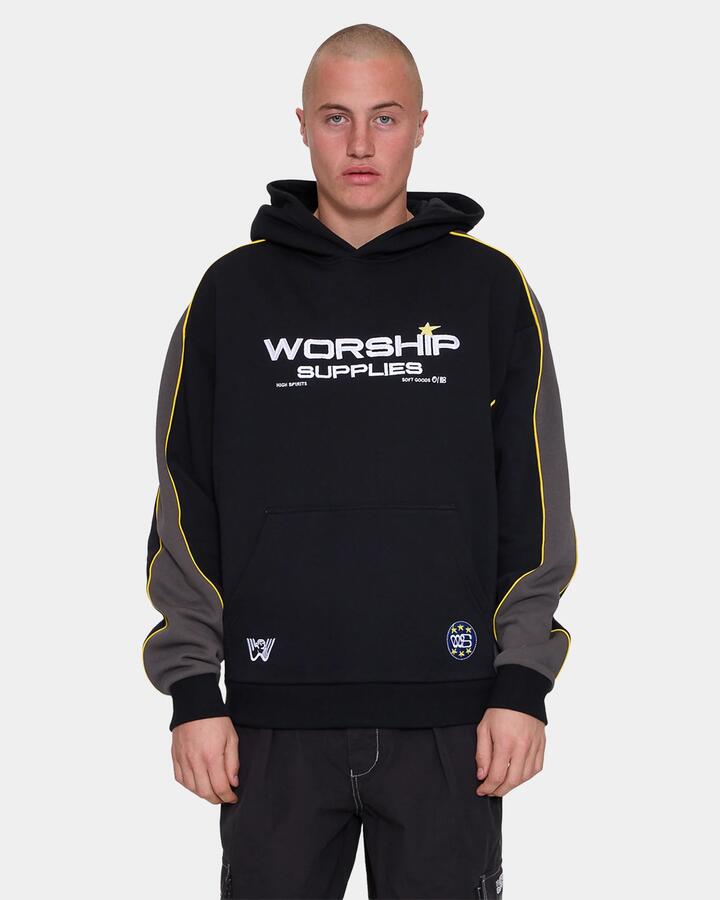 Image of a model wearing Outerwear. Product name - Worship Mens Laser Panel Pullover Hoodie Black in Black colour by brand - Worship