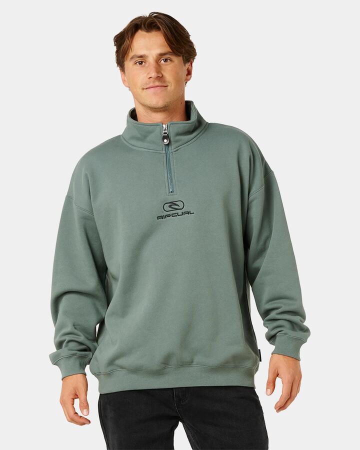 Image of a model wearing Outerwear. Product name - Rip Curl Mens Pill Icon 1/4 Zip Fleece Jumper Moss in Moss colour by brand - Rip Curl
