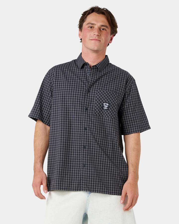 Image of a model wearing Tops. Product name - Rip Curl Mens Liquid Trips Check Short Sleeve Shirt Washed Black in Washed Black colour by brand - Rip Curl