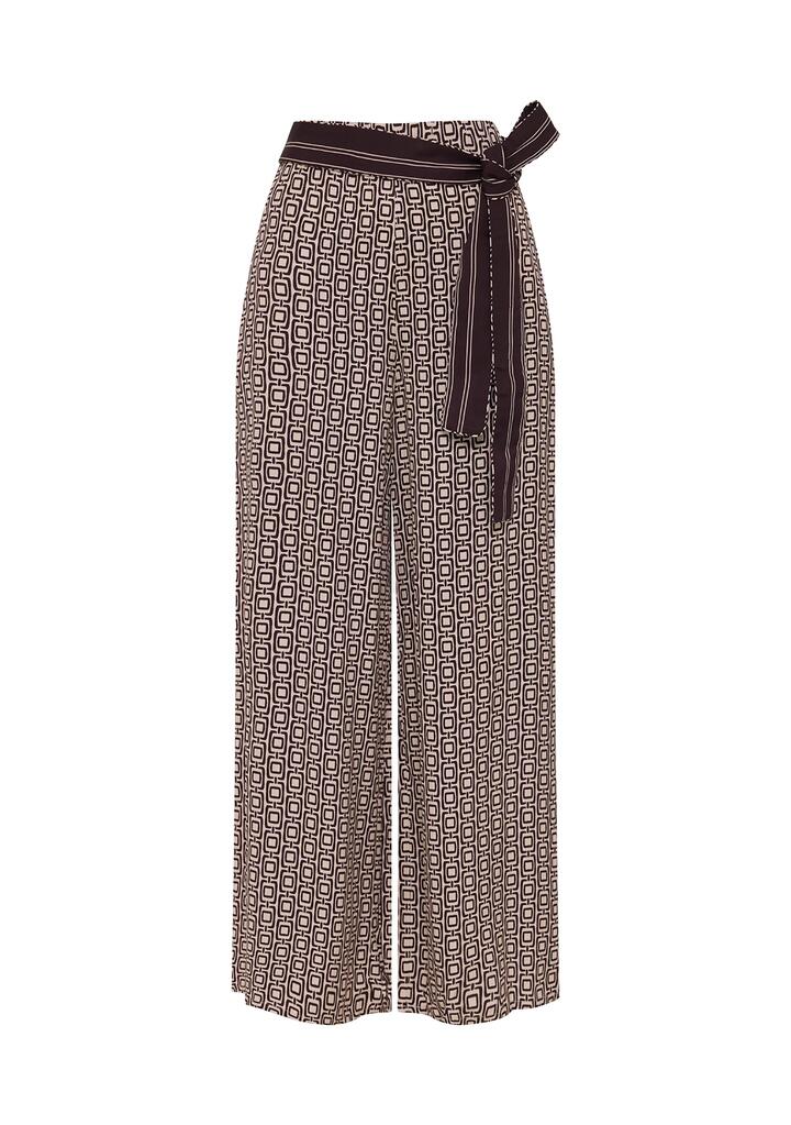 Image of a model wearing Pants. Productname: Prismic Print Pants | MOS The Label in Prismic Print colour by brand - MOS The Label