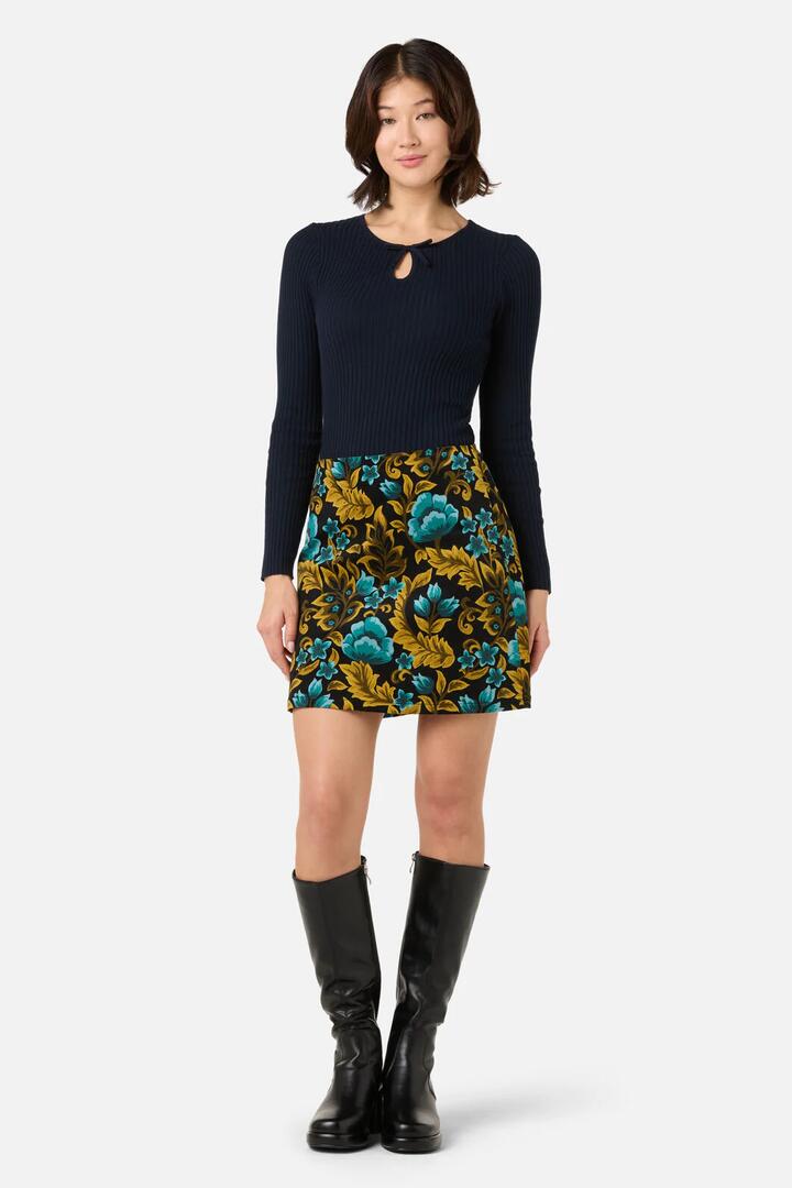 Image of a model wearing Skirts. Productname: Azura Velvet Mini Skirt in Blue colour by brand - Princess Highway