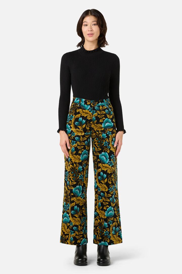 Image of a model wearing Pants. Productname: Azura Velvet Pant in Rust colour by brand - Princess Highway