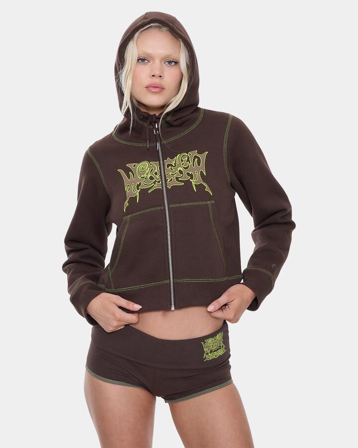 Image of a model wearing Outerwear. Product name - Worship Womens Trouble Zip Fleece Jacket Ganache in Ganache colour by brand - Worship
