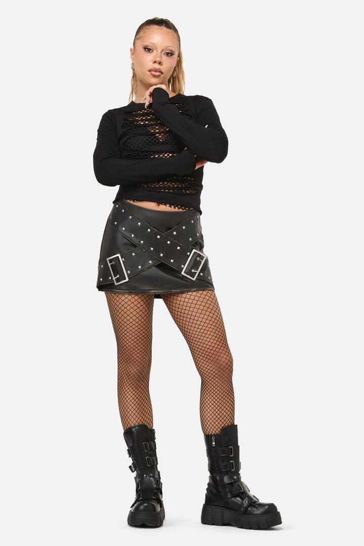 Image of a model wearing Skirts. Productname: Sleaze Punk PU Skirt in Black colour by brand - Dangerfield