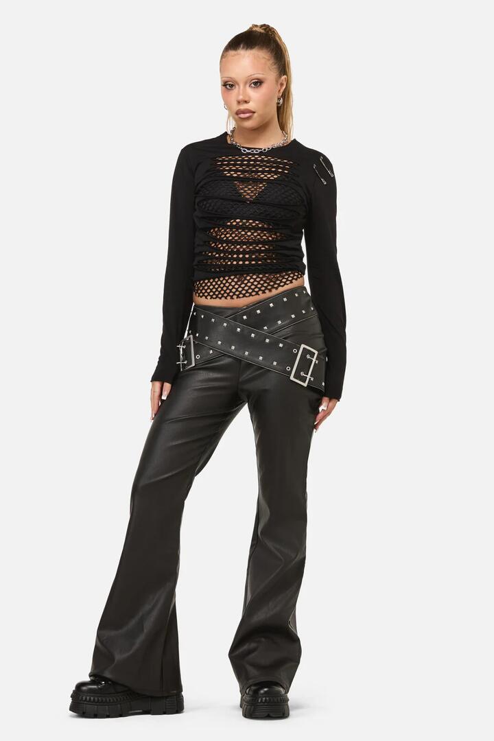 Image of a model wearing Pants. Productname: Sleaze Punk PU Pant in Black colour by brand - Dangerfield