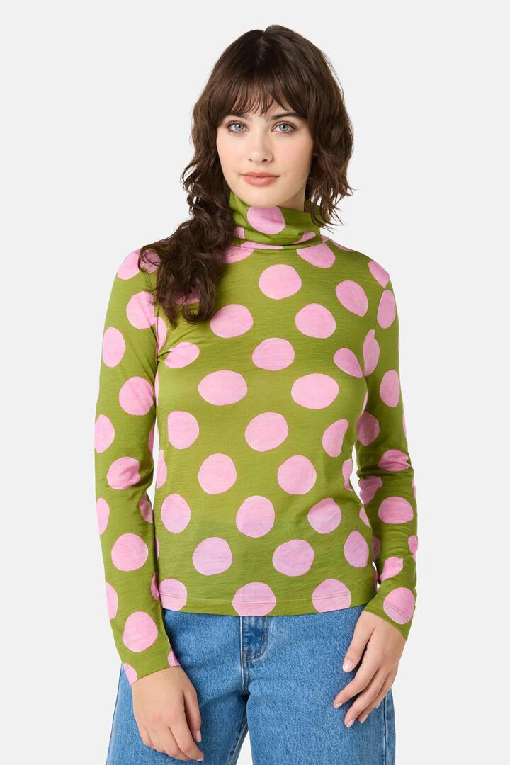 Image of a model wearing Tops. Product name - Always Spot It Merino Polo in Print colour by brand - Gorman